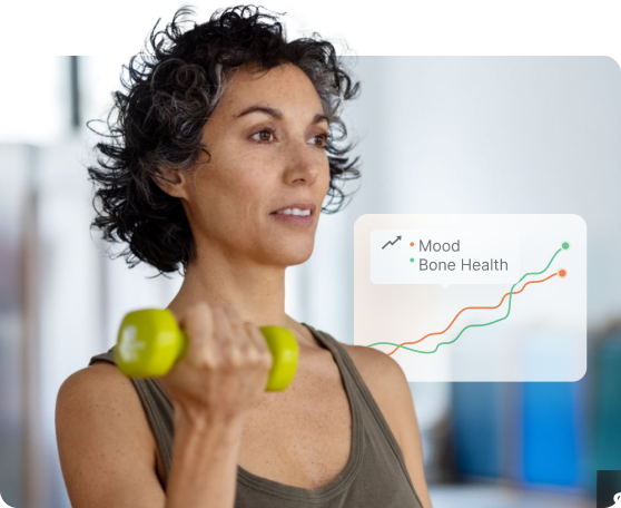 A woman with curly hair lifts a small green dumbbell